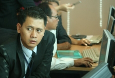 Uczestnicy szkolenia siedzą przy komputerach